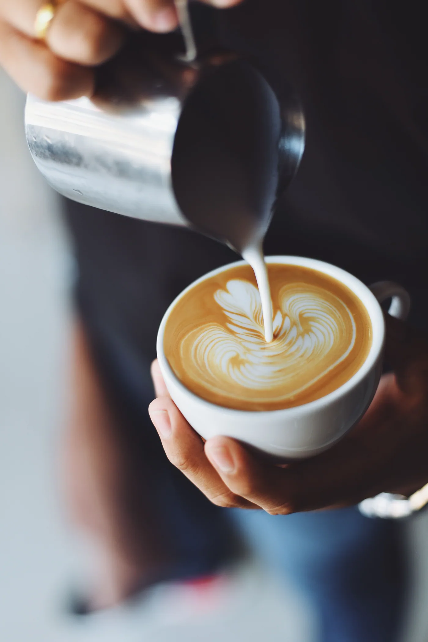 Espresso machine pouring into a paper cup